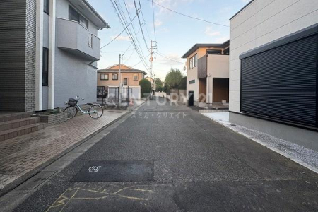 �����s���c�J���Α�5���ڂ̐V�z��ˌ��Ă̑O�ʓ��H�܂ތ��n�ʐ^